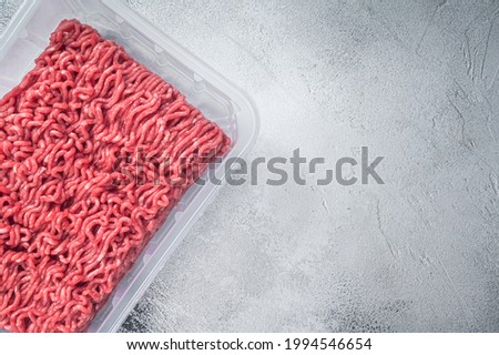 Fresh Raw mince beef and pork meat in vacuum packaging. White background. Top view. Copy space