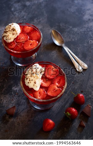 jelly with strawberries and whipped cream