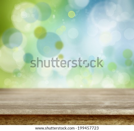 Empty table in front of abstract background