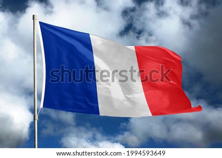 France flag on sky and cloud background. National symbols of France. Flag of France.