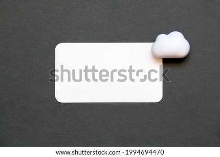 business card with a small cloud in the upper right corner on a dark solid color background