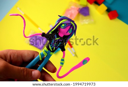 plasticine figurine of a fictional character for a cartoon or game made by the hands of a child, a children's hobby.