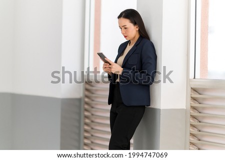 portrait of A middle-aged Asian working women looking at camera