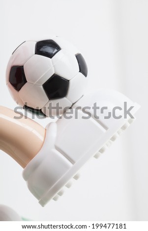 toy soccer ball on his leg
