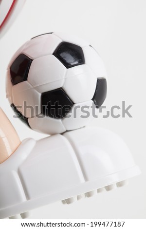 toy soccer ball on his leg