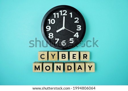 Cyber Monday with clock on blue background