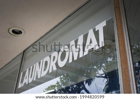 Retro laundromat sign on window