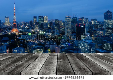 empty modern wooden terrace with abstract city blurred bokeh night light background, copy space for display of product presentation, advertisement, cityscape, interior decoration design concept