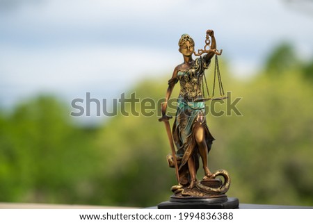 Statue of Themis. Symbol of justice and law, crime and punishment, legal law concept.