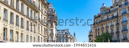 Paris, beautiful buildings in the 16th arrondissement, boulevard de Beausejour, with the Eiffel tower in background