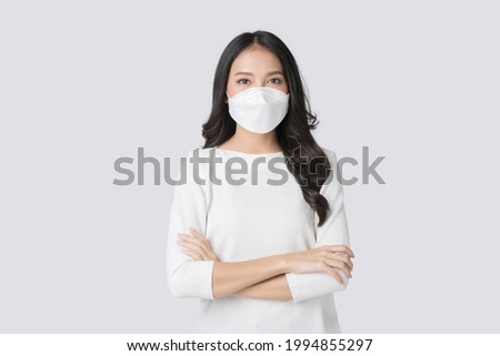 Young Asian woman wearing hygienic mask to prevent infection corona virus Air pollution pm2.5 in isolated on white background Royalty-Free Stock Photo #1994855297