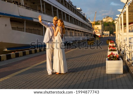 young couple walking in the seaport