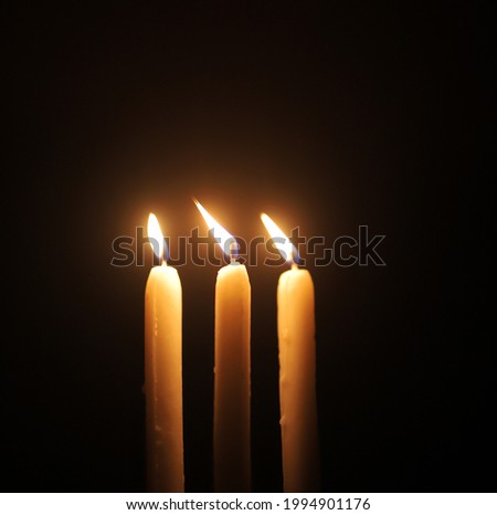 simple candle with black background 