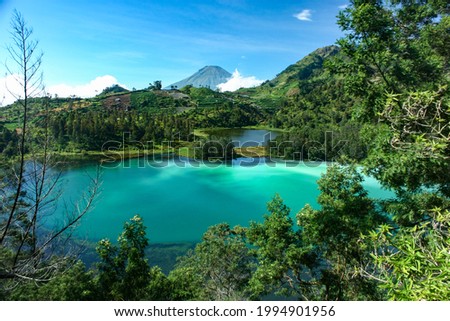 Scenic view of Telaga Warna or Colors Lake, a tri-colors lake in Dieng highland, Wonosobo, Central Java, Indonesia. Royalty-Free Stock Photo #1994901956