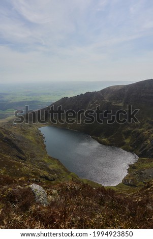 stunning landscape of mountains from a very high point where you can see a large lake. Comeragh Mountains, Waterford, Ireland.