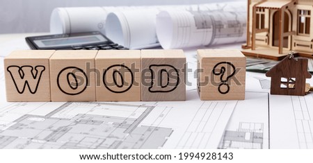 wooden cubes with the inscription of a wood, a question mark.