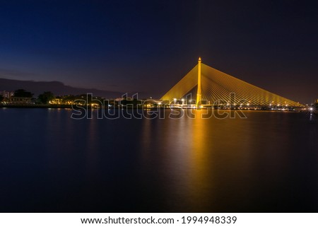 Rama VIII Bridge, Bangkok, Thailand during the beautiful sunset. Long exposure photography technique.