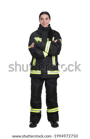 Full length portrait of firefighter in uniform on white background