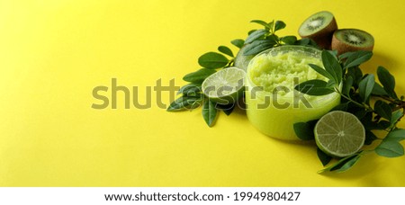 Skin care scrub concept on yellow background