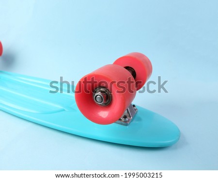 Close up penny board wheel on blue background