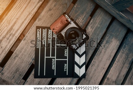 camera and video production equipment on wooden background