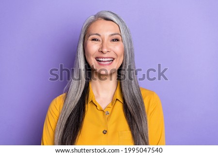 Portrait of attractive cheerful woman laughing good mood isolated over bright violet purple color background