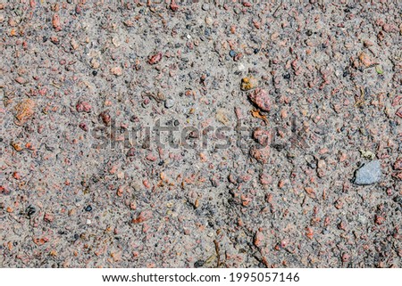 Texture of asphalt stones and sand on the ground