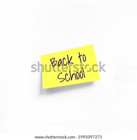 Isolated Yellow sticker with Back to School Handwriting text on white Whatman paper. Concept programming, testing, business. Handwriting text, copy space Royalty-Free Stock Photo #1995097271