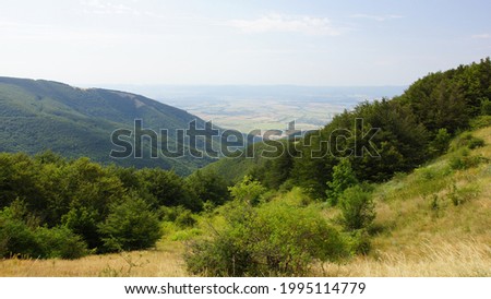 Panoramic view of Balkan mountains and Kazanlak Valley near Shipka village from Buzludzha Monument viewpoint. National park-museum shipka-buzludzha. Shipka pass. Kazanlak (Kazanluk). Bulgaria.