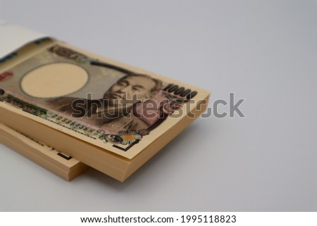 Japanese 10,000 yen bill in an envelope.
translation:Manufactured by the National Printing Bureau,Yukichi Fukuzawa.