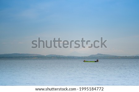 Picture of villagers rowing boats fishing in the middle of the river to bring food to Siridhorn Dam Ubon Ratchathani Province, Thailand