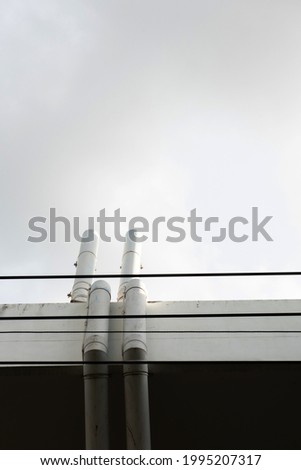 White pipe on a white wall stock photo