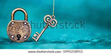 Escape room game banner, old vintage key and padlock on a blue  background.  Royalty-Free Stock Photo #1995218915