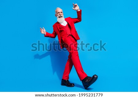 Low angle view full size photo of aged rich man happy positive smile dancer music isolated over blue color background Royalty-Free Stock Photo #1995231779
