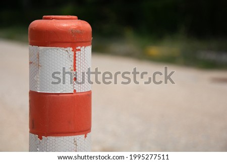 Traffic cone. Orange plastic traffic warning sign. Warning inventory for road safety. Road construction or parking area