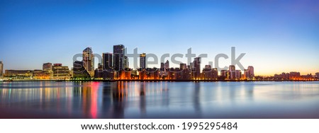 Panorama of Canary Wharf business district at dawn in London. England