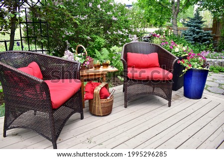 Backyard oasis patio with lush landscaped private outdoor living for relaxing on warm days
