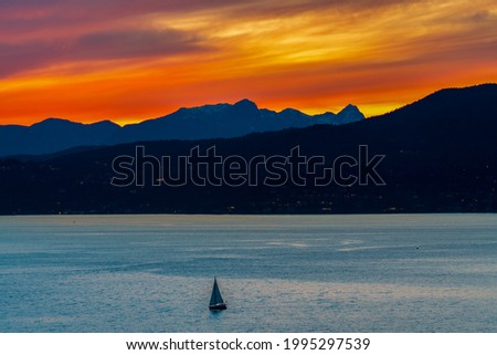 calm ocean and mountain views with beautiful sunset sky backgrounds