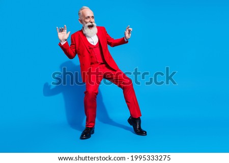 Full size photo of cheerful aged man dandy happy positive smile dance party club isolated over blue color background Royalty-Free Stock Photo #1995333275
