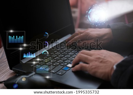 Businessman working laptop computer with big data analytics visualization technology with business analyzing information structure on screen 