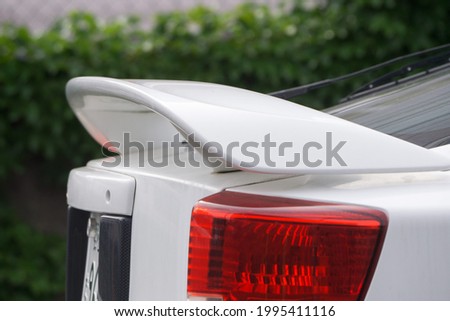 Rear view with big spoiler at Rear of car Royalty-Free Stock Photo #1995411116