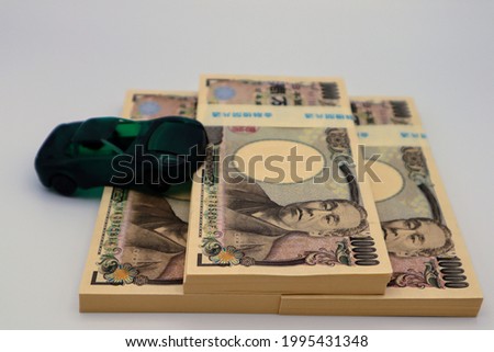 Image of car purchase cost.
translation:Japanese silver,10,000,
Japanese silver,Common to financial institutions,Yukichi Fukuzawa.