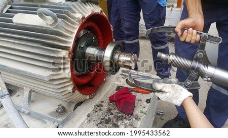 Rotor shaft and bearing for electric motor , Overhaul electric motor and change new bearing for electric motor onsite service Royalty-Free Stock Photo #1995433562