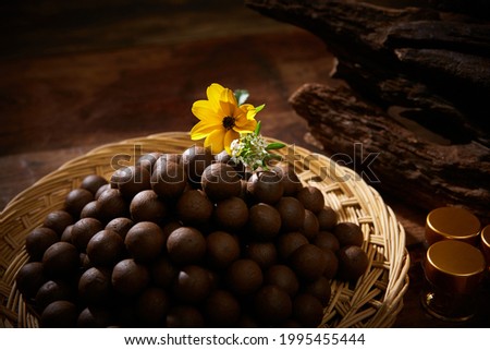 Oriental medicine pills piled up on a strainer tray. Royalty-Free Stock Photo #1995455444