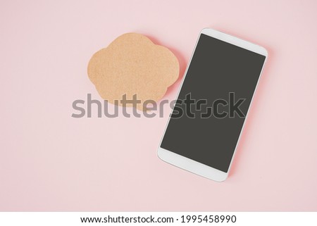 white smart phone with clipping path on touchscreen , blank grunge brown speech bubble  paper on sweet pink background , communication , network, social distancing concept