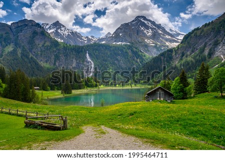 idyllic Lake Lauenensee with Wildhorn in spring, Bernese Alps, Switzerland Royalty-Free Stock Photo #1995464711