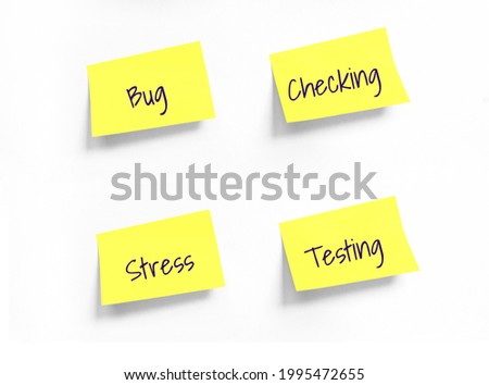 Four Yellow stickers with Bug, Checking, Stress, Testing Handwriting text on white Whatman paper. Concept programming, testing, business. Handwriting text, copy space