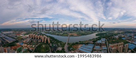 Panoramic image of an industrial park in Shenzhen, Guangdong Province, China. The vast sky and the winding river. The theme picture of China's industrial development and integration of urban and rural