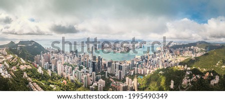 Amazing aerial view of the Victoria Harbour of Hong Kong, Clear sunny day, drone shot panorama.