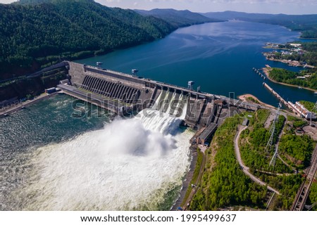 View of the hydroelectric dam on the river, water discharge from the locks, aerial photo Royalty-Free Stock Photo #1995499637
